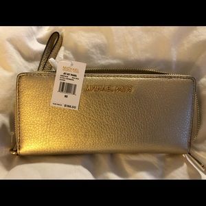 Michael Kors gold wallet. Brand new